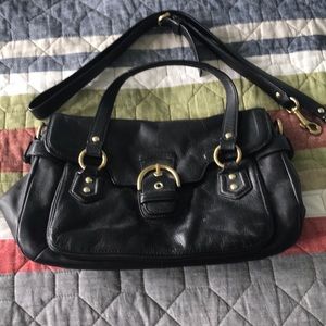 Well loved Coach purse black with gold details.